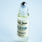 Perfume Oil Rollerball bottle with the roller exposed with the label Black Swan Society Halcyon 10ml