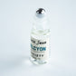 Perfume Oil Rollerball bottle with the roller exposed it has the label Black Swan Society Halcyon 4ml