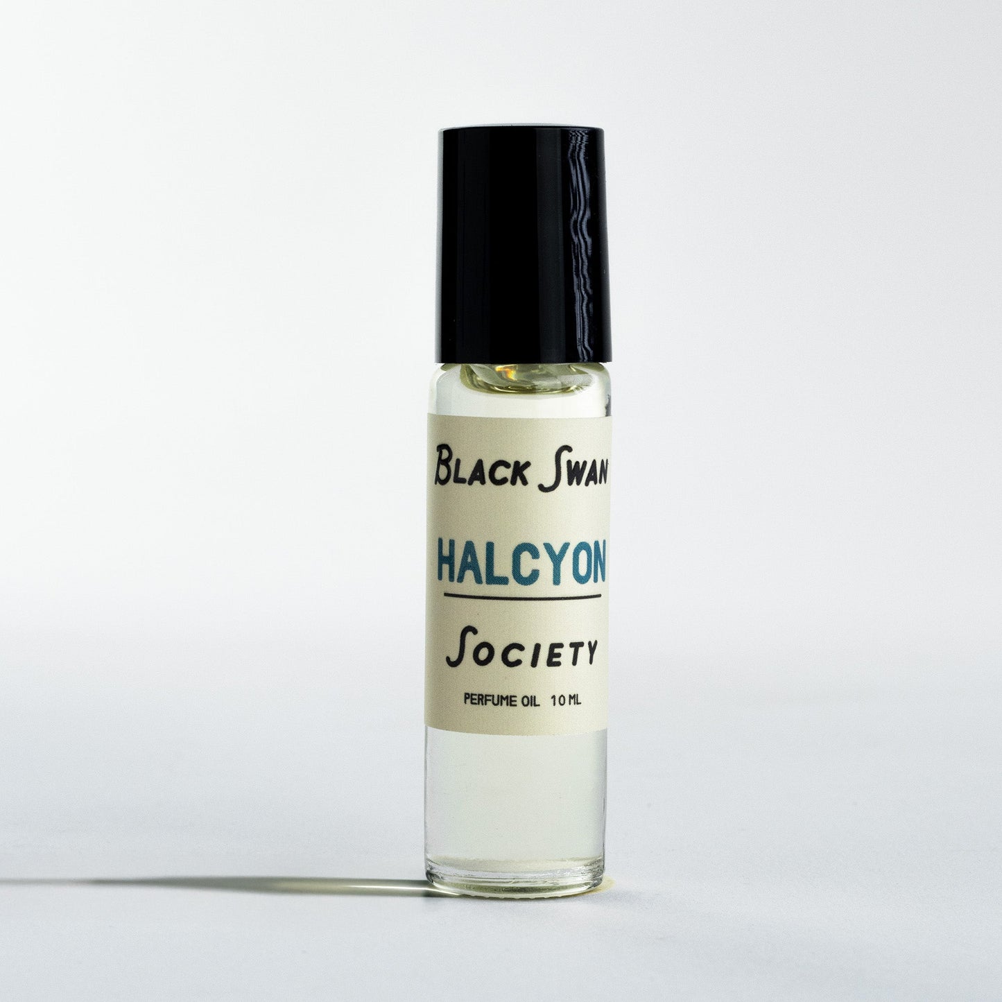 Perfume Oil Rollerball bottle with the label Black Swan Society Halcyon 10ml