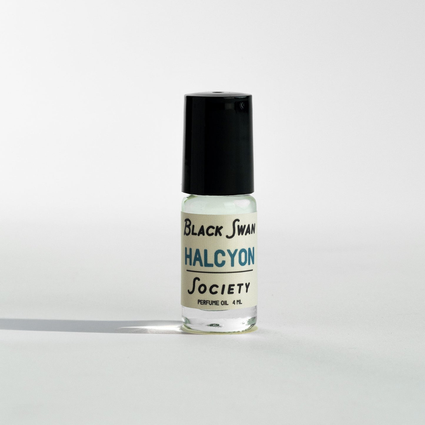 Perfume Oil Rollerball bottle with the label Black Swan Society Halcyon 4ml