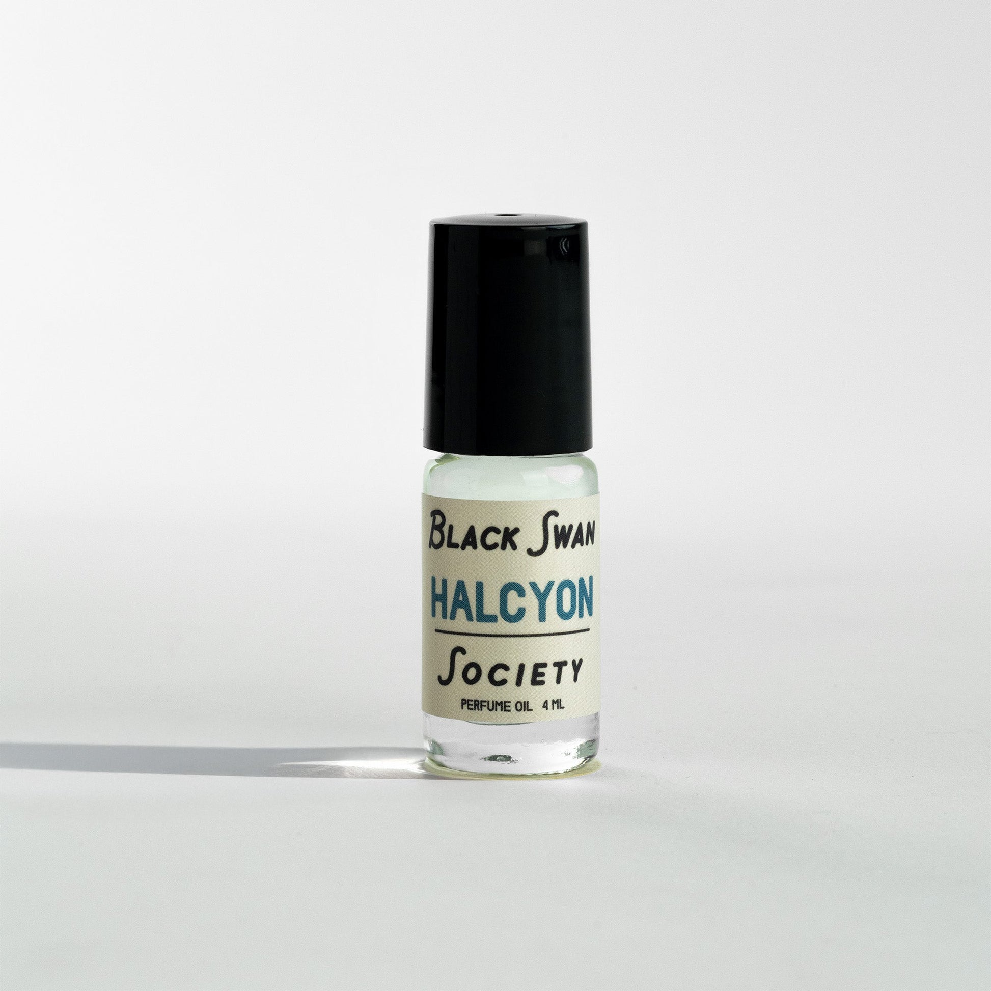Perfume Oil Rollerball bottle with the label Black Swan Society Halcyon 4ml